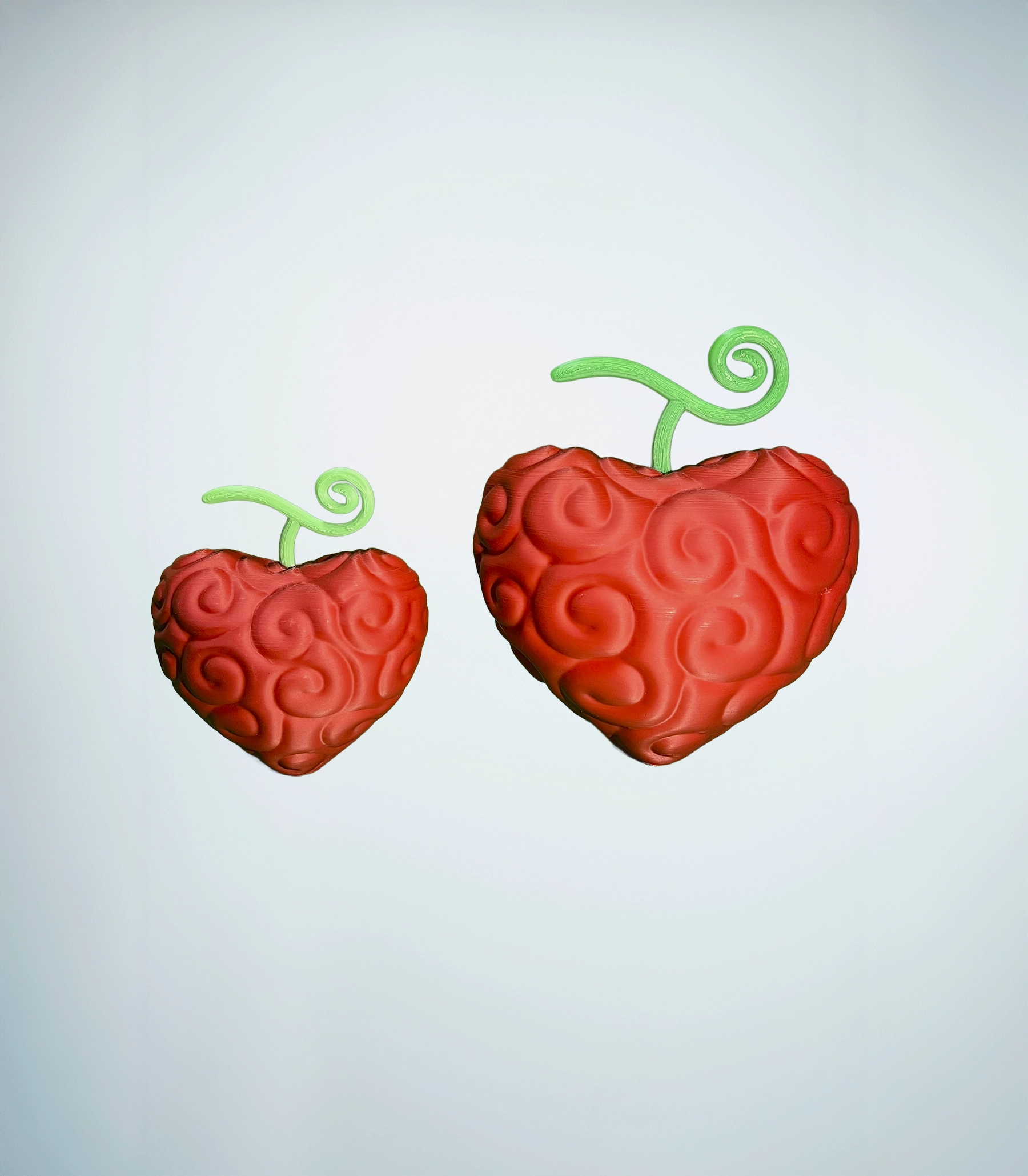 Fruta Grande Corazon impresa en 3d 14x17 cm en comparación con la pequeña de 12x16 cm