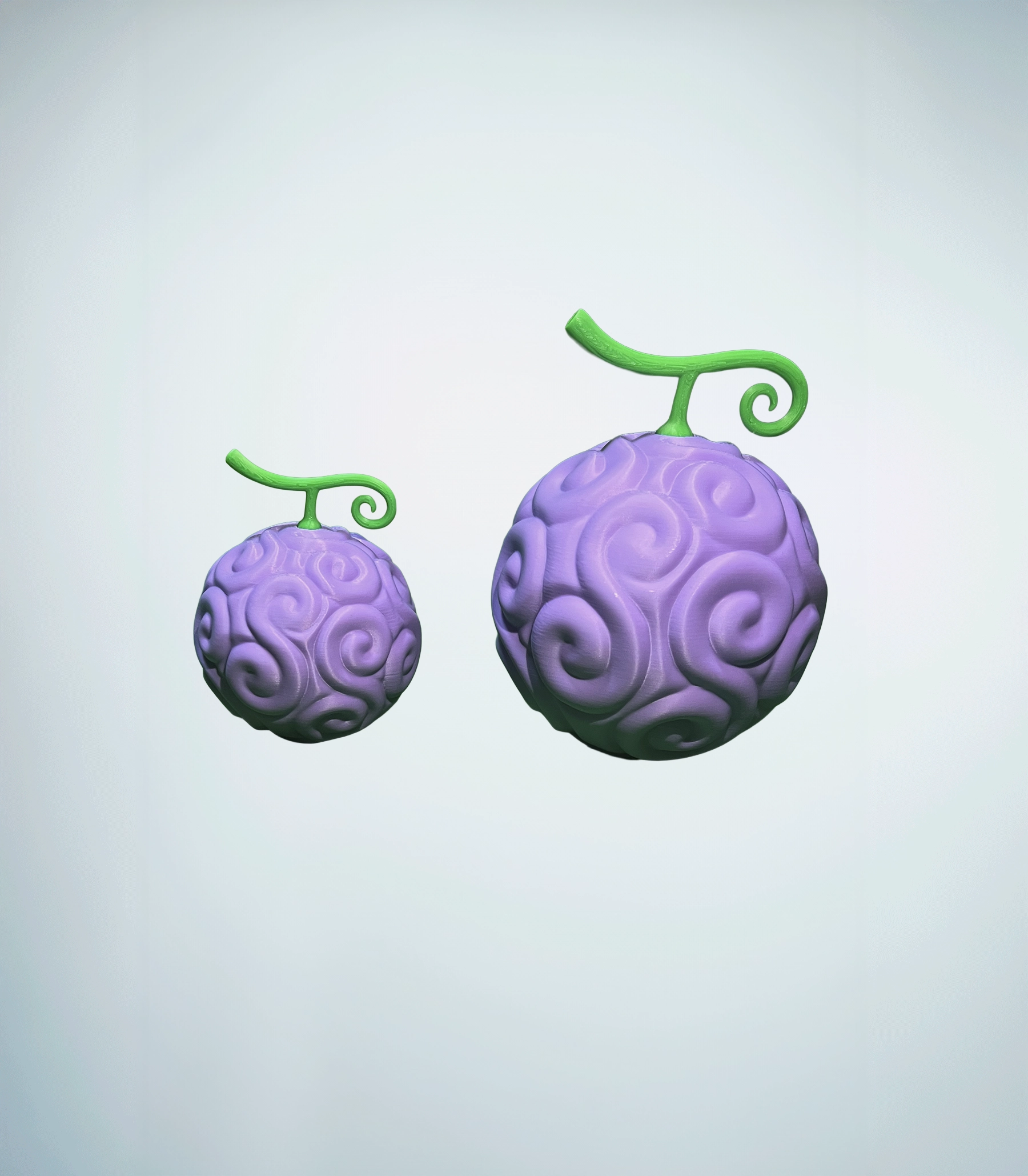 Fruta del diablo nika impresa en 3D de 14x17cm en comparacion con la pequeña de 16x12 cm